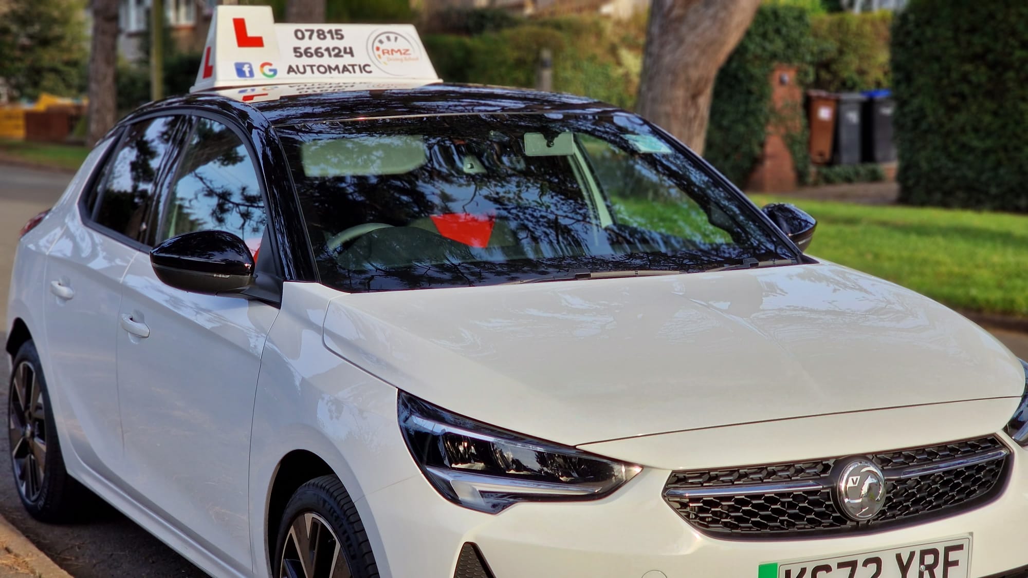 RMZ Driving School white Vauxhall Corsa learner car