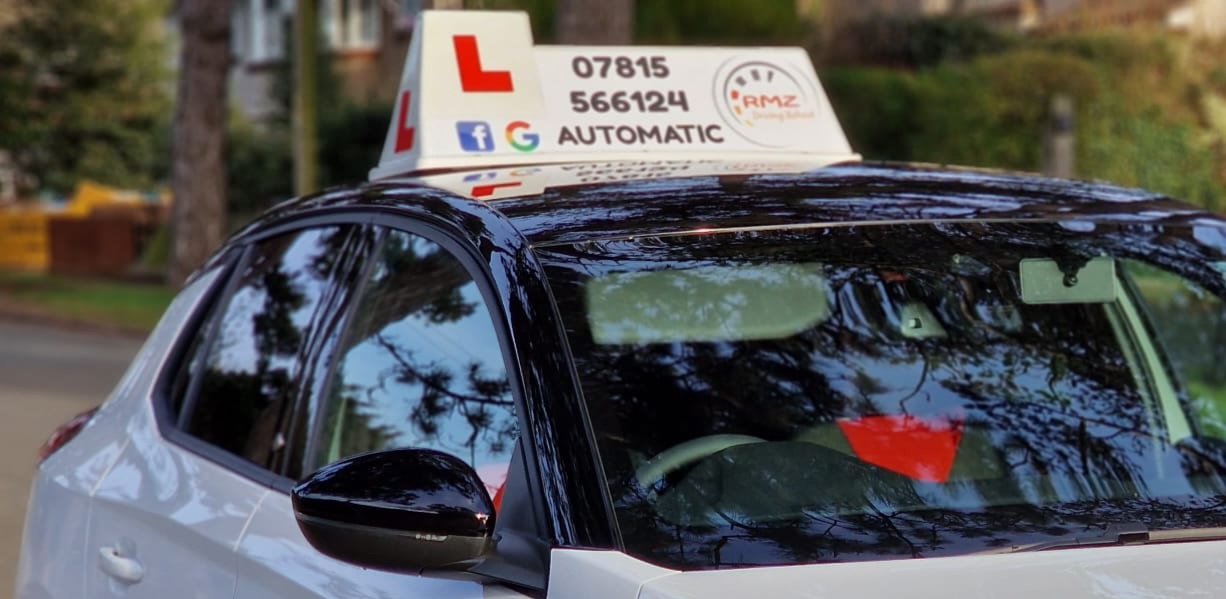 White Corsa with RMZ rooftop sign